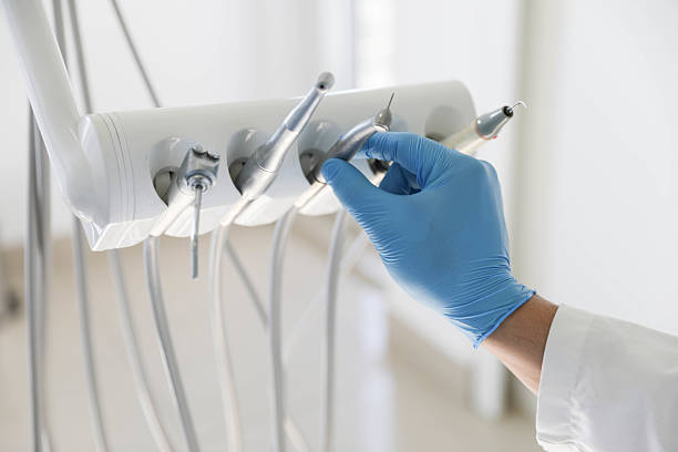 Professional Tooth Extraction technician working in Central Islip, NY